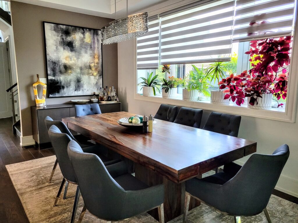 This open dining area connects seamlessly to the living space. Warm lighting and modern finishes give it an inviting, family-friendly feel.