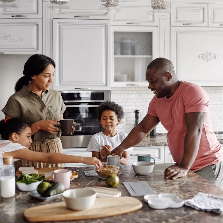 A generational family in a newly renoed kitchen.
